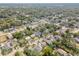 Aerial view of a neighborhood with a focus on a single-Gathering home at 8416 N Semmes St, Tampa, FL 33604