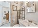 Clean bathroom with sink, toilet, and shelving at 8416 N Semmes St, Tampa, FL 33604