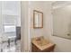 Small bathroom with a sink and mirror at 8416 N Semmes St, Tampa, FL 33604
