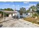 Front yard with carport and small landscaping at 8416 N Semmes St, Tampa, FL 33604