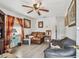 Living room featuring a leather couch and hardwood floors at 8416 N Semmes St, Tampa, FL 33604
