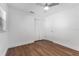 Bright bedroom with wood-look floors and double closets at 10206 Lola St, Tampa, FL 33612