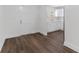 Simple dining area with wood-look floors and kitchen at 10206 Lola St, Tampa, FL 33612