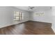 Open living room, featuring wood-look floors and window at 10206 Lola St, Tampa, FL 33612