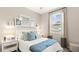 Bright bedroom with a queen-size bed and window at 10615 Sun Drop St, Venice, FL 34293