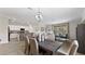 Open concept dining area with kitchen and living room views at 10615 Sun Drop St, Venice, FL 34293