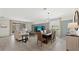 Bright dining room with wood table and seating for six at 10615 Sun Drop St, Venice, FL 34293