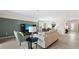 Spacious living room with comfortable seating and natural light at 10615 Sun Drop St, Venice, FL 34293