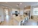 Island kitchen with granite counters and stainless steel appliances at 10741 Buttercup Ct, Venice, FL 34293