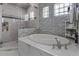 Upscale bathroom featuring a large tub and shower at 12437 Meinert Ave, Brooksville, FL 34613