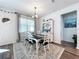 Bright dining room featuring a farmhouse table and white hutch at 12969 Brookside Moss Dr, Riverview, FL 33579