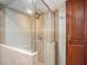 Clean bathroom with a large walk-in shower and wood cabinets at 1601 Lakeview Rd, Clearwater, FL 33756