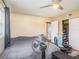 Spacious bedroom with large bed, ceiling fan, and closet at 1601 Lakeview Rd, Clearwater, FL 33756