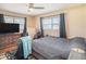 Comfortable bedroom with a large bed, dresser, and TV at 1601 Lakeview Rd, Clearwater, FL 33756