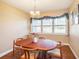 Bright dining room with wood table and large window at 1601 Lakeview Rd, Clearwater, FL 33756