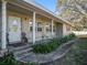 Covered front porch with white columns and entryway at 1601 Lakeview Rd, Clearwater, FL 33756