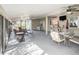 Spacious screened patio with seating and dining areas at 1601 Lakeview Rd, Clearwater, FL 33756