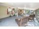 Spacious screened porch with wicker furniture at 1601 Lakeview Rd, Clearwater, FL 33756
