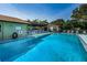 Beautiful community pool and patio area with plenty of seating at 1669 Fry Ct, Dunedin, FL 34698