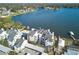 Aerial view showing condo building, pool, and lake access at 3127 W Sligh Ave # 203B, Tampa, FL 33614