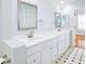 Bathroom with double vanity, marble accents, and a tiled floor at 3127 W Sligh Ave # 203B, Tampa, FL 33614