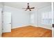 Bright bedroom with hardwood floors, ceiling fan, and window shutters at 3127 W Sligh Ave # 203B, Tampa, FL 33614