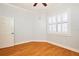 Well-lit bedroom with hardwood floors and window shutters at 3127 W Sligh Ave # 203B, Tampa, FL 33614