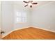 Bright bedroom with hardwood floors and plantation shutters at 3127 W Sligh Ave # 203B, Tampa, FL 33614