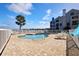 Resort-style pool with patio furniture, offering a lake view at 3127 W Sligh Ave # 203B, Tampa, FL 33614