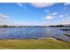 Scenic waterfront view with calm water and lush greenery at 3127 W Sligh Ave # 203B, Tampa, FL 33614