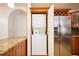 Stacked washer and dryer in kitchen at 3127 W Sligh Ave # 203B, Tampa, FL 33614