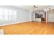 Spacious living area with kitchen peek and hardwood floors at 3127 W Sligh Ave # 203B, Tampa, FL 33614
