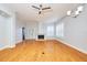 Open living area with hardwood floors and a ceiling fan at 3127 W Sligh Ave # 203B, Tampa, FL 33614