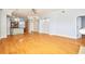 Open concept living room with kitchen view and hardwood floors at 3127 W Sligh Ave # 203B, Tampa, FL 33614