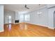 Bright living room featuring hardwood floors and a fireplace at 3127 W Sligh Ave # 203B, Tampa, FL 33614