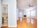 Spacious living room with hardwood floors, fireplace, and access to balcony at 3127 W Sligh Ave # 203B, Tampa, FL 33614