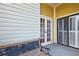 Private patio with french doors and bench at 3127 W Sligh Ave # 203B, Tampa, FL 33614