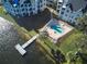 Inviting community pool with patio furniture and lake access at 3127 W Sligh Ave # 203B, Tampa, FL 33614