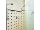 Clean shower with black and white diamond patterned tile at 3127 W Sligh Ave # 203B, Tampa, FL 33614
