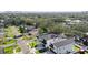 Aerial view of a modern two-story house with a fenced backyard, located in a residential neighborhood at 3402 W Grace St, Tampa, FL 33607