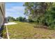 Backyard oasis with canal view and patio at 3438 Moog Rd, Holiday, FL 34691