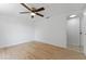 Bedroom with wood-look floors and ceiling fan at 3438 Moog Rd, Holiday, FL 34691
