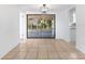 Dining room with tile floors and sliding doors to patio at 3438 Moog Rd, Holiday, FL 34691