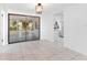 Dining room with tile floors and sliding doors to patio at 3438 Moog Rd, Holiday, FL 34691