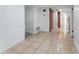 Clean hallway with tile flooring and access to other rooms at 3438 Moog Rd, Holiday, FL 34691