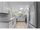 Modern kitchen with granite countertops and white cabinets at 3438 Moog Rd, Holiday, FL 34691