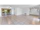 Spacious living area with tile floors and access to a patio at 3438 Moog Rd, Holiday, FL 34691