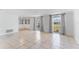Bright living room with tile floors and large windows at 3438 Moog Rd, Holiday, FL 34691