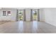 Bright living room with tile floors and large windows at 3438 Moog Rd, Holiday, FL 34691