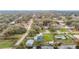 High-angle view of home, pool, and detached garage near canal at 37525 Moore Dr, Dade City, FL 33525